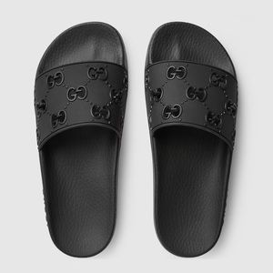 Women's Gucci rubber GG slide sandal